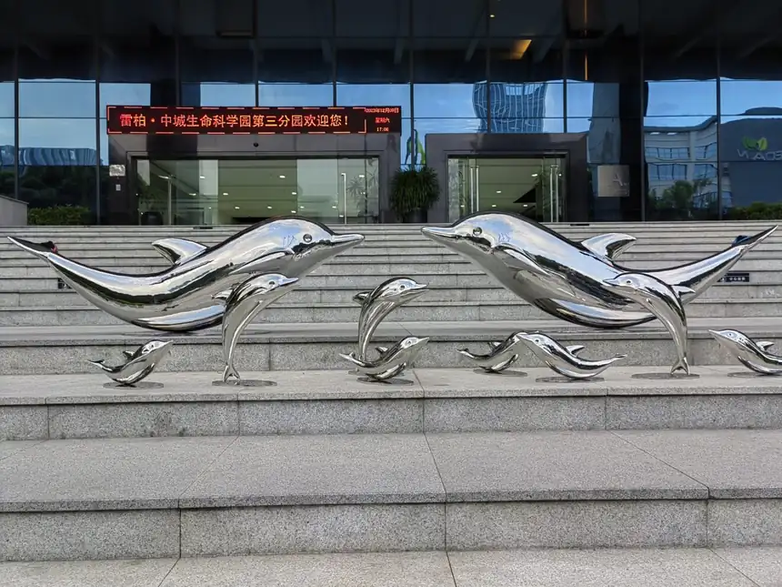 The Enchanting Beauty of Metal Dolphin Sculptures