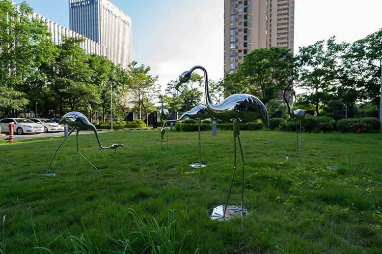 Stainless steel bird sculpture.