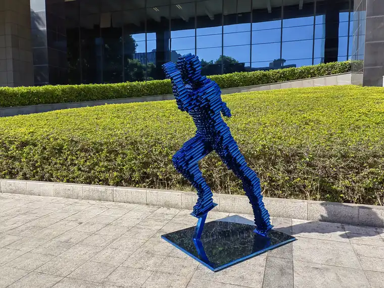 The Beauty of Stainless Steel Sculpture: Abstract Runner Running in the Wind at Santa Monica Manor