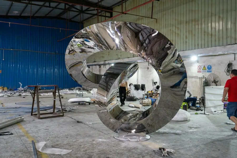 Large outdoor stainless steel streamer sculpture