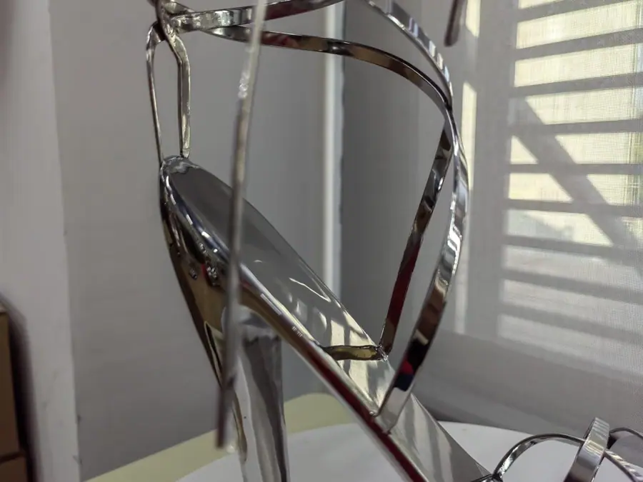 Stainless steel high heel art sculpture