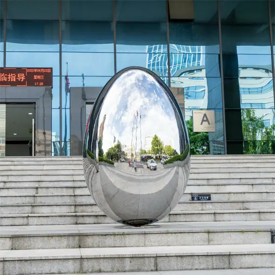Outdoor stainless steel elliptical spherical sculpture