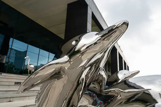 Stainless steel dolphin sculpture