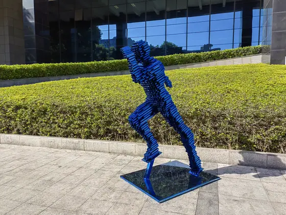 The Beauty of Stainless Steel Sculpture: Abstract Runner Running in the Wind at Santa Monica Manor