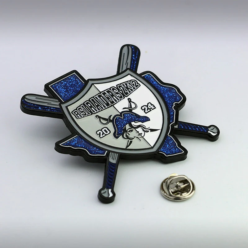 Set of baseball trading pins with blue glitter and silver plating on a white background