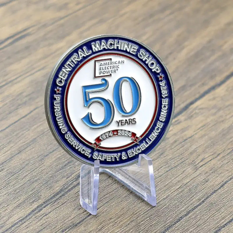 Close-up of hand enamel filling and baked colour on a 50th anniversary challenge coin