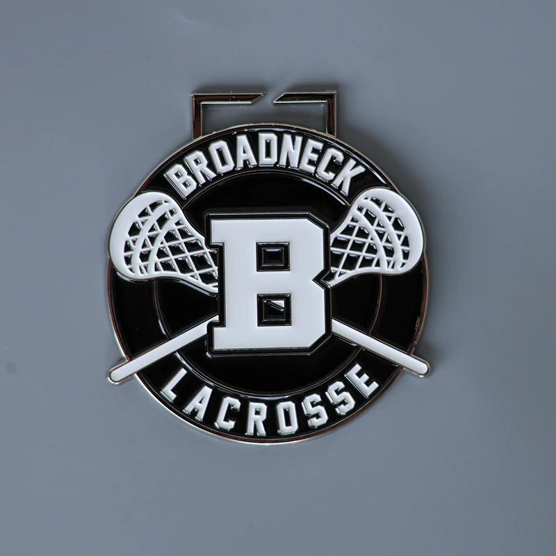 Reverse side and pin back detail of a custom die struck lacrosse team medal