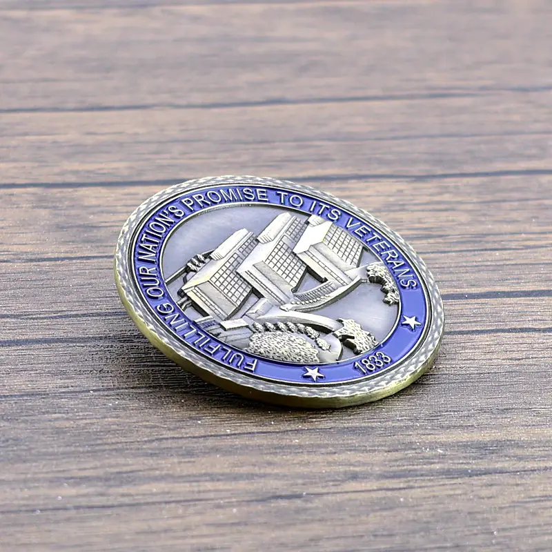 Side view of a die struck challenge coin showing raised edges and soft enamel fill