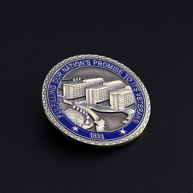 Custom challenge coin of a U.S. landmark with red white and blue enamel and polished gold finish