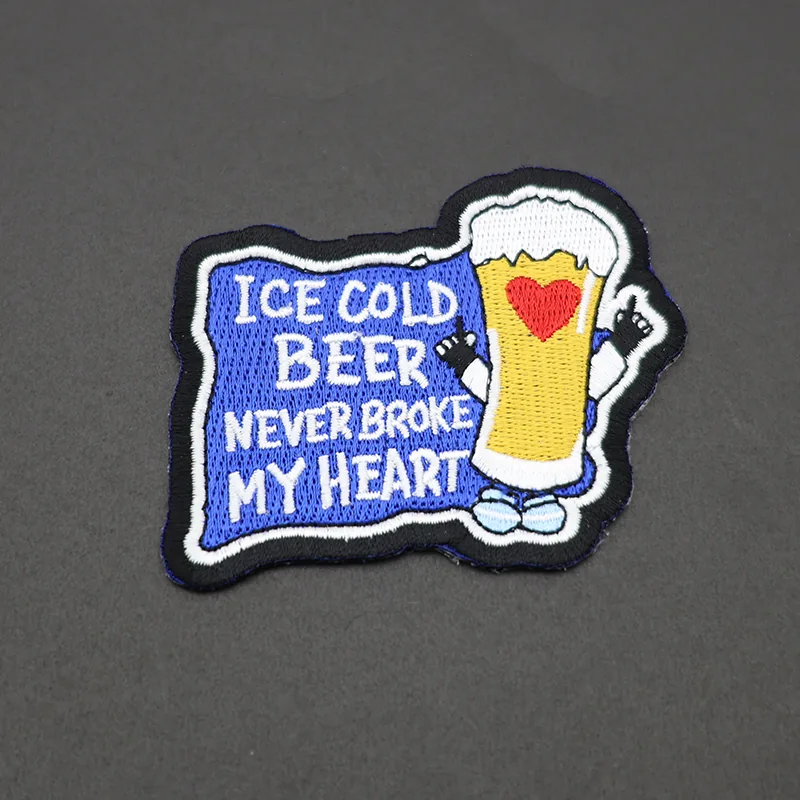 PVC beer patch with a raised plastic surface and bold red and black design, showing a beer bottle and logo