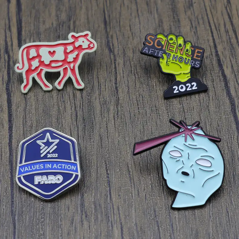Set of custom buffalo and shield lapel pins with different plating finishes and pin backs
