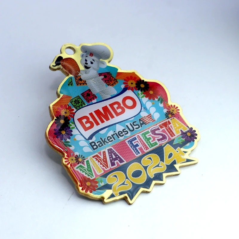 Custom 2024 Fiesta soft enamel lapel pin with epoxy dome, showing vibrant colours and glossy finish