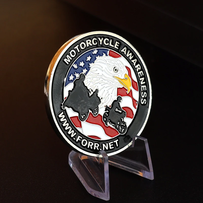 Set of three custom challenge coins in gold silver and bronze finishes with the same eagle design