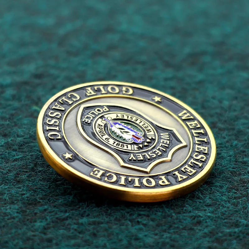 Close-up of the antique brass finish and raised relief on a custom challenge coin