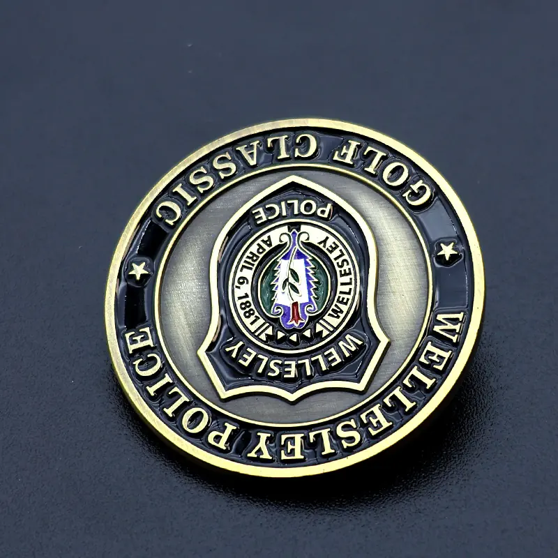 Custom antique brass challenge coin with raised relief and hand-applied finish