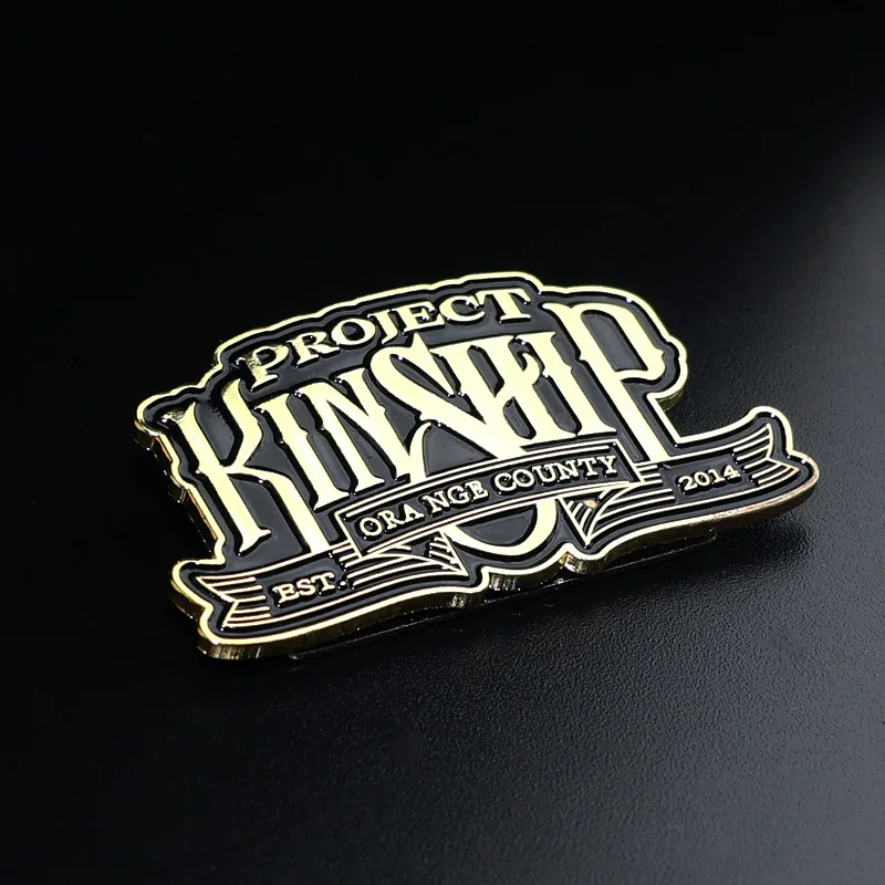 Reverse side of the antique brass lapel pin with clean metal finish and pin back