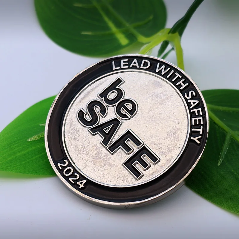 Custom gold challenge coin with 'be safey' text and safety-themed design in soft enamel