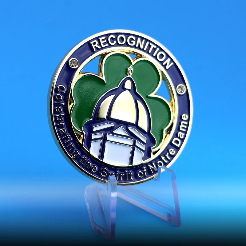 Multiple custom clover coins in different finishes and enamel colours
