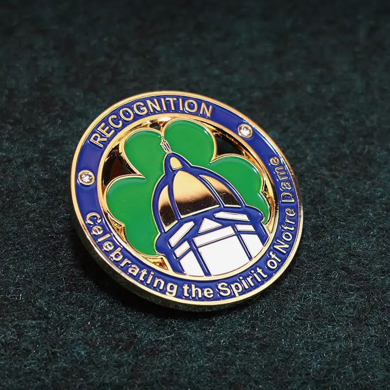 Clover challenge coin with lanyard loop attached, shown in natural light