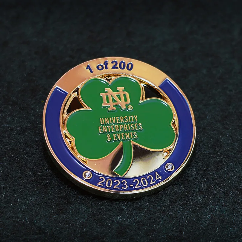 Custom polished gold clover challenge coin with green enamel and rounded edge