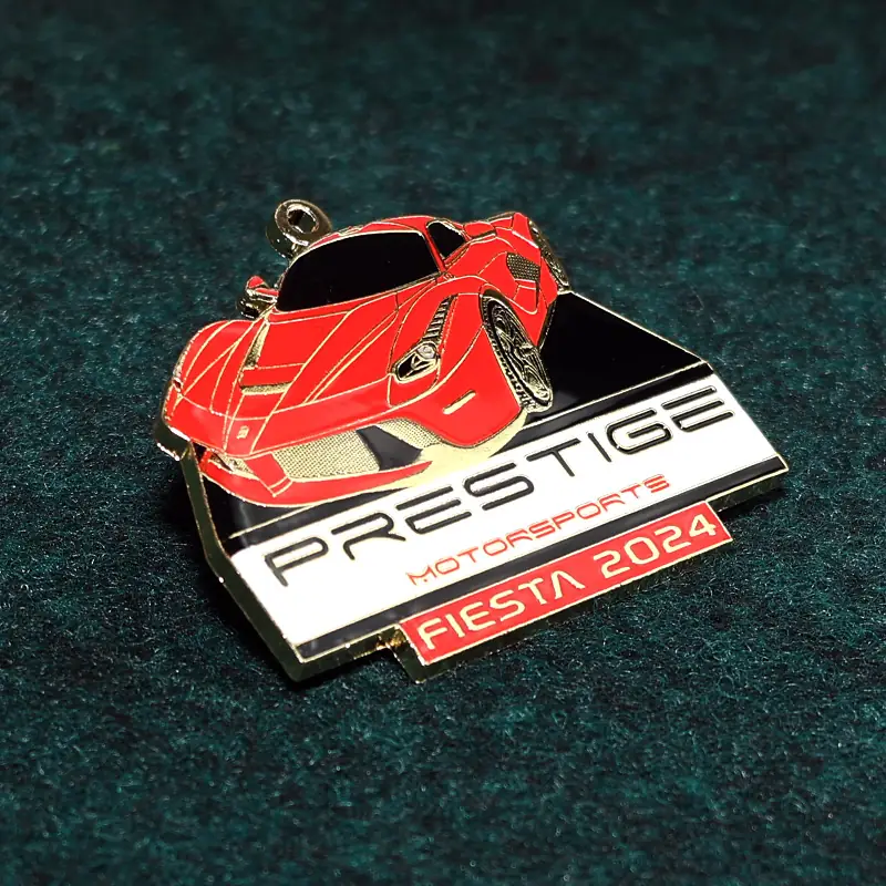 Close-up of epoxy dome and soft enamel detail on a custom Fiesta medal with raised relief