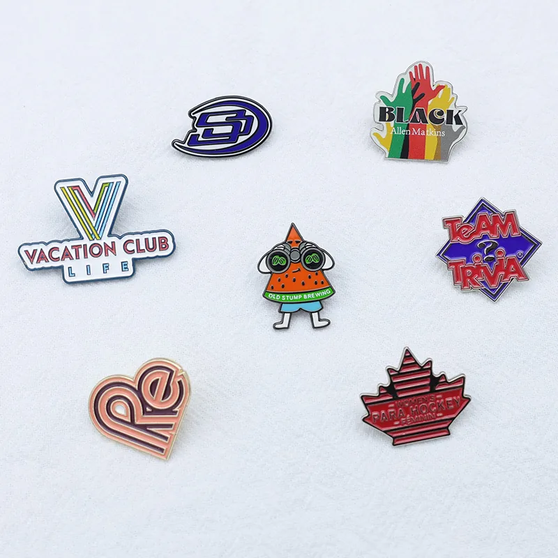 Back view of hand-shaped heart pin with blank reverse and safety pin back