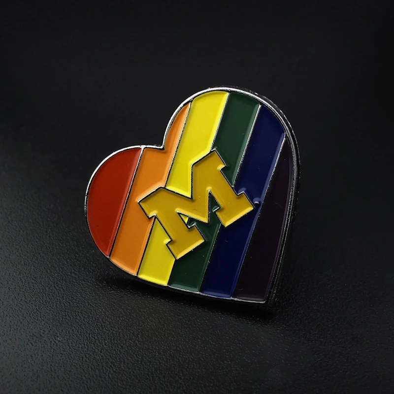 Reverse side of a heart-shaped lapel pin with safety pin attachment