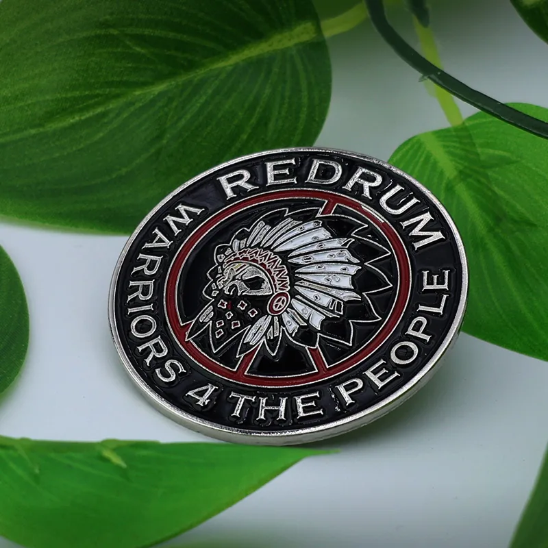 Close-up of a custom round lapel pin with soft enamel colours and a standard pin back