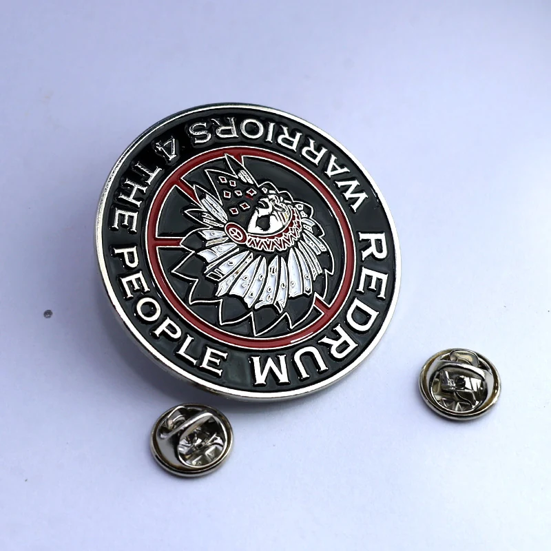 Custom round lapel pin with soft enamel fill and polished gold finish, showing detailed artwork and raised edges