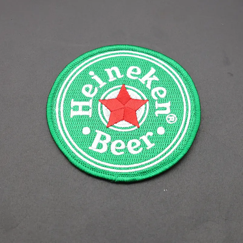 Close-up of a PVC round star beer patch with vibrant colour and detailed logo
