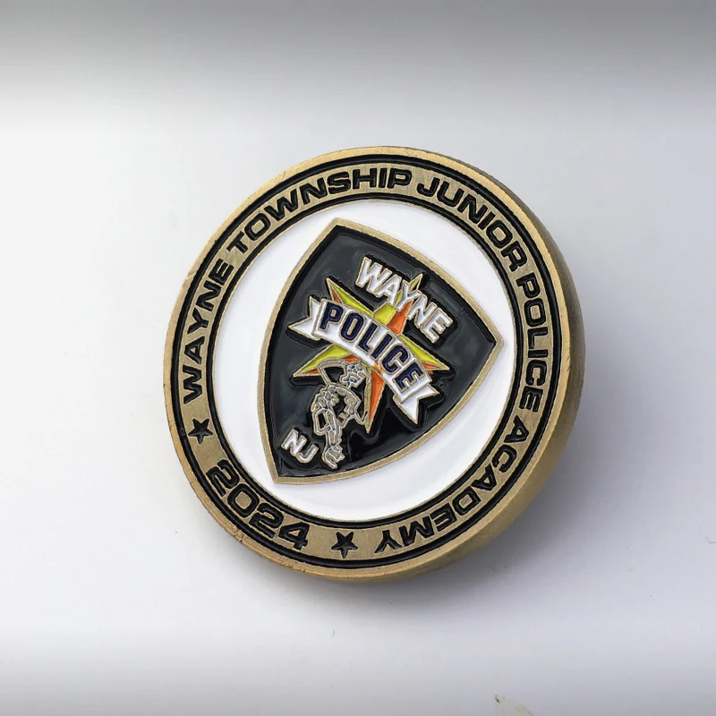 Reverse side of a custom challenge coin with a blank field for engraving