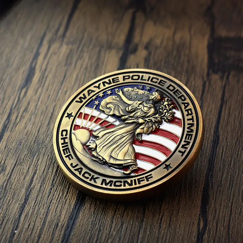 Custom gold Statue of Liberty challenge coin with red white and blue enamel on a brass body