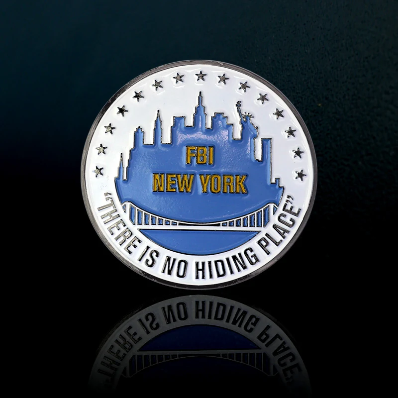 Custom antique silver challenge coin with detailed emblem and text in circular shape