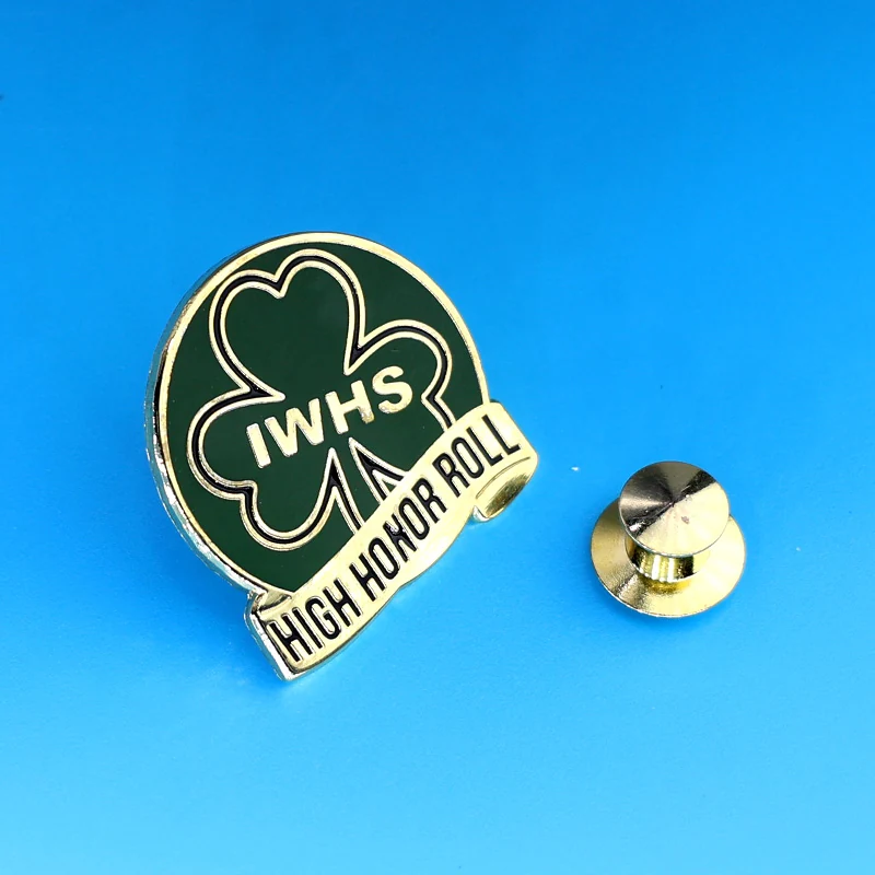 Close-up of the clover design and pin back on a custom enamel lapel pin