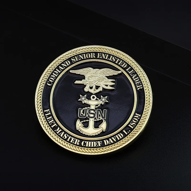Close-up of a custom Earth challenge coin with soft enamel fill and textured surface