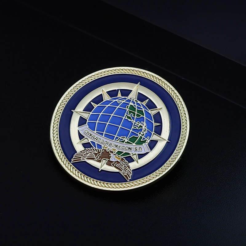 Custom Earth challenge coin with green and blue enamel on a polished gold finish