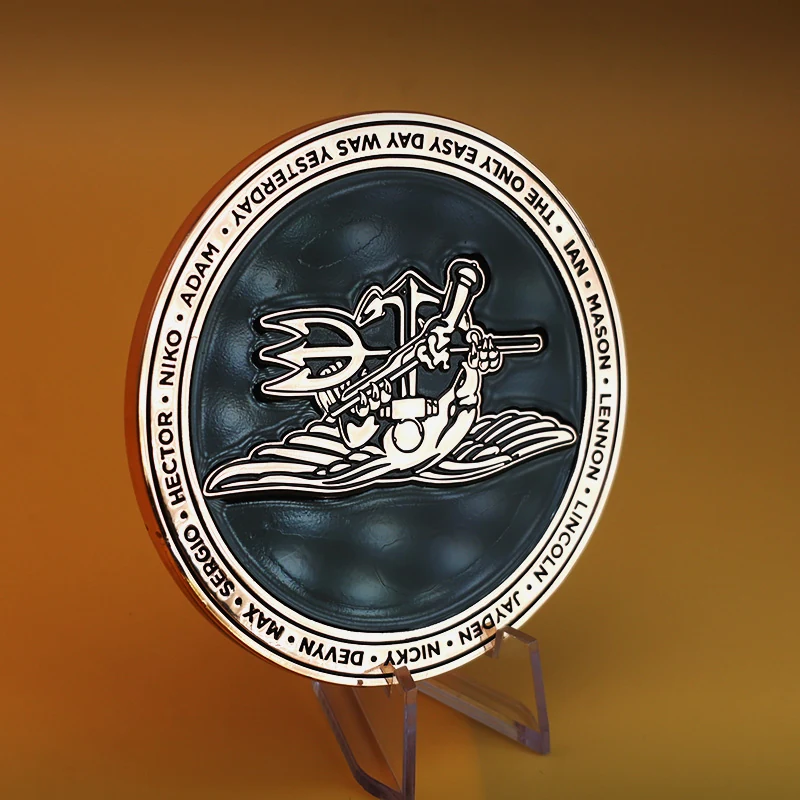 Detail of the snake design and enamel fill on a custom challenge coin with a pin back