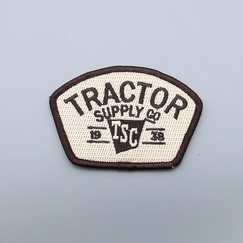 Custom embroidered TSC patch with detailed logo and text on a fabric base
