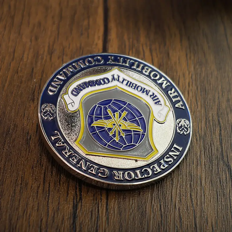 Set of three custom Navy challenge coins in gold silver and bronze variants