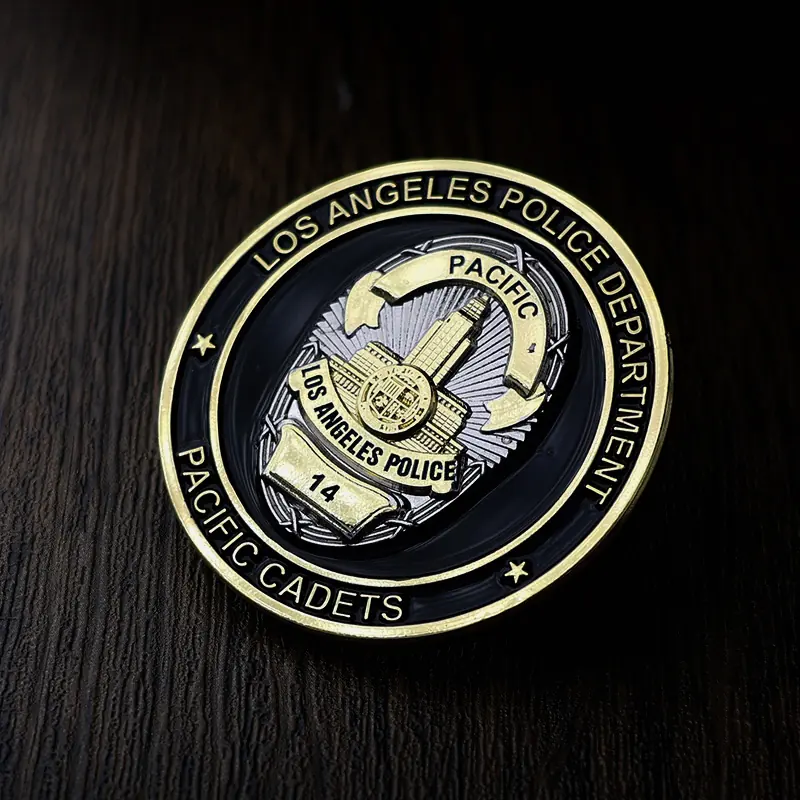 Side view of a custom 3D challenge coin with gold plating and enamel colour in recessed areas