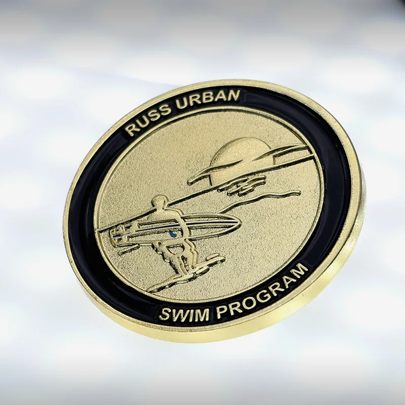 Custom 3D challenge coin with gold plating and soft enamel fill, showing detailed relief and raised text