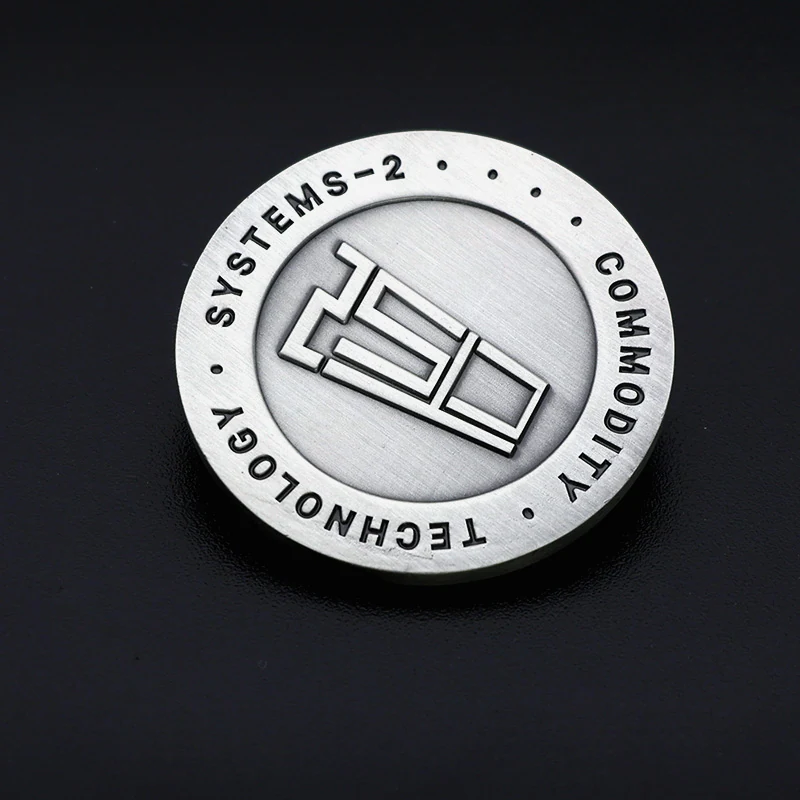 Reverse side of a custom antique silver challenge coin with engraved logo