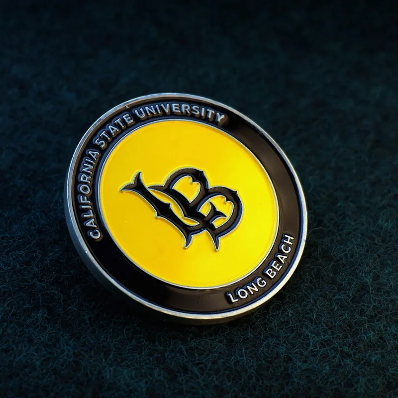 Close-up of soft enamel fill and raised relief on a beach-themed challenge coin