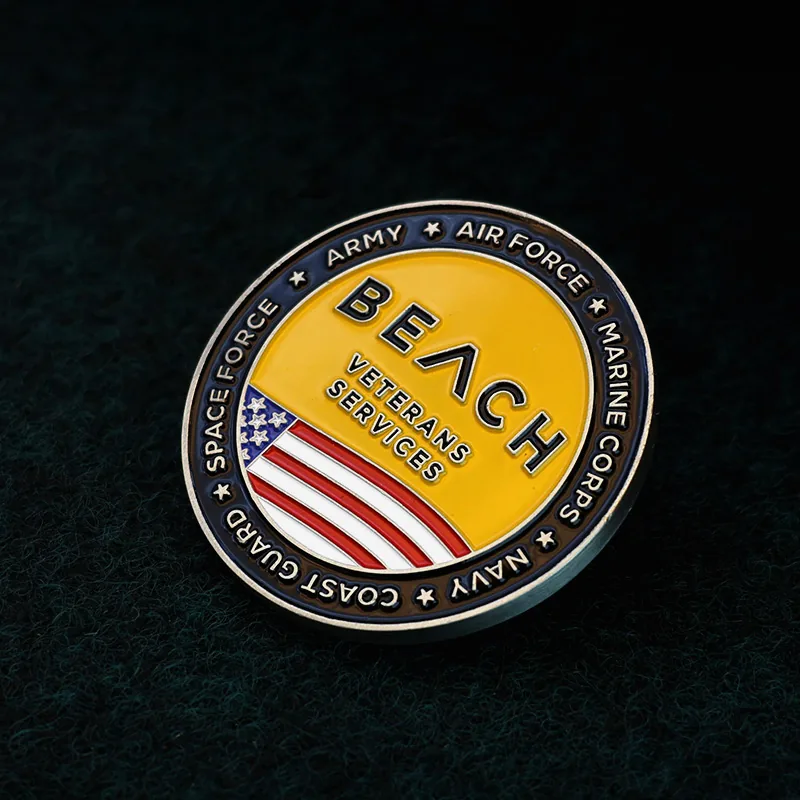 Set of custom challenge coins with beach and US flag designs, displayed with lanyard loops