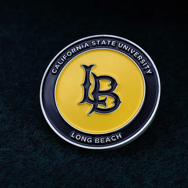 Reverse side of a custom challenge coin with beach and US flag design, showing the struck detail