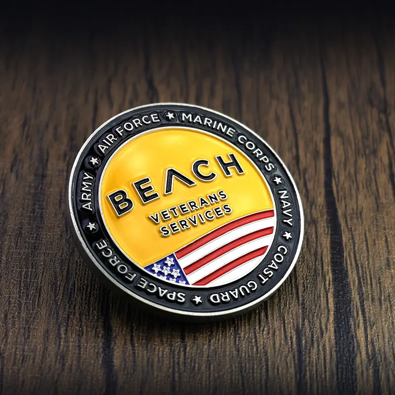Custom die struck challenge coin with a beach scene and US flag logo in polished gold finish