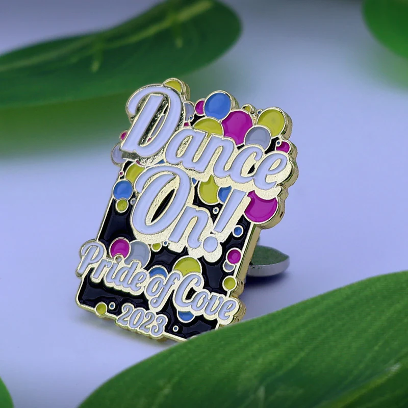Reverse side of a custom word lapel pin with a standard pin back