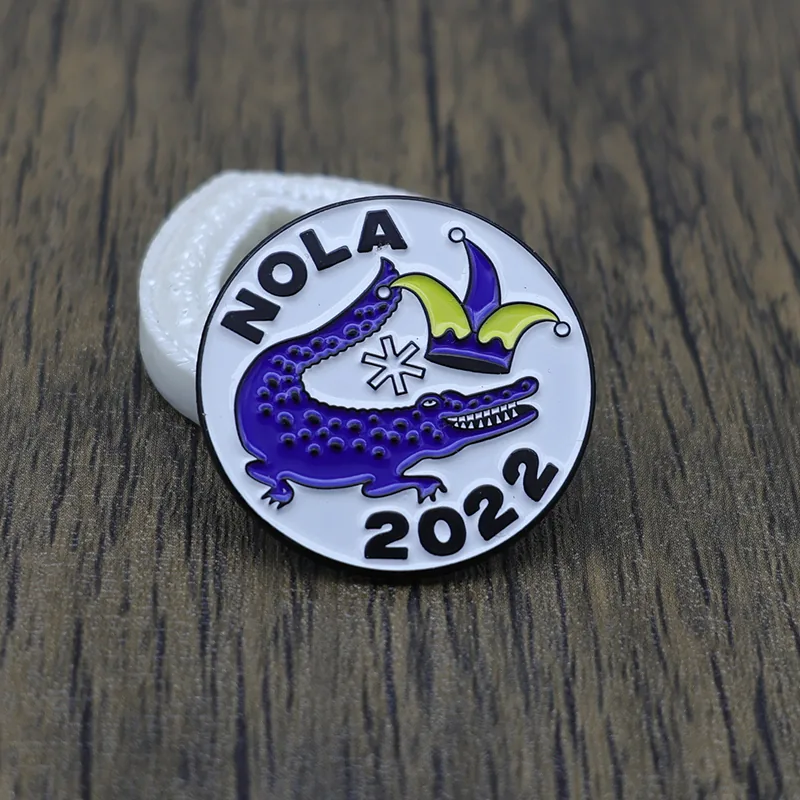 Reverse side and pin back detail of a custom little crocodile enamel lapel pin
