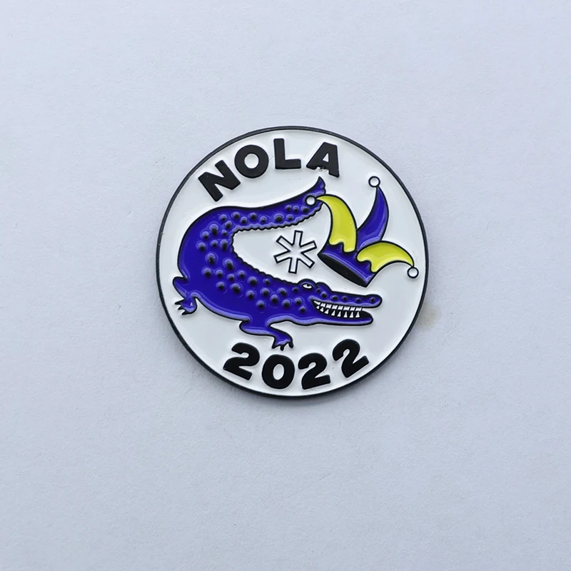 Round custom little crocodile enamel lapel pin with green and brown soft enamel on a polished silver finish