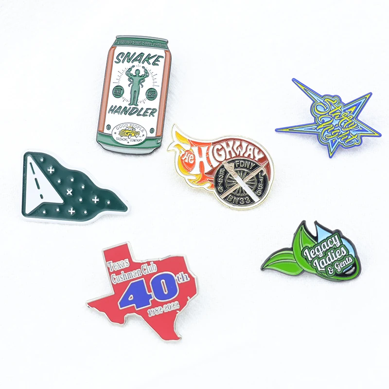 Set of custom gift-style pins including map and water bottle designs on a white background